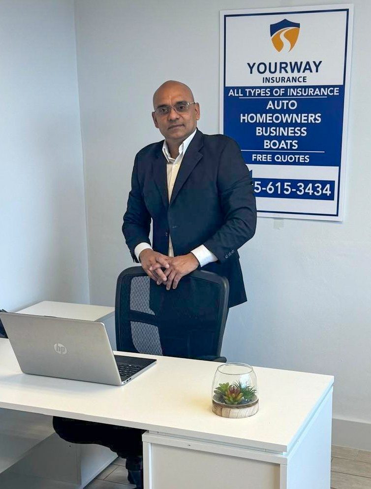 Jorge Molina, founder of YourWay Insurance, in the agency office